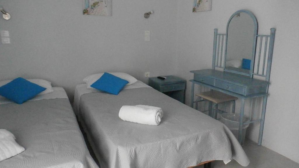 Łóżko lub łóżka w pokoju w obiekcie Passos Rooms