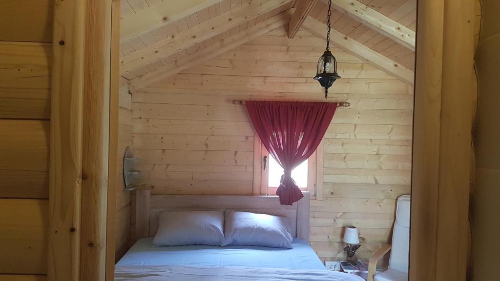 Postel nebo postele na pokoji v ubytování EtnoPetra