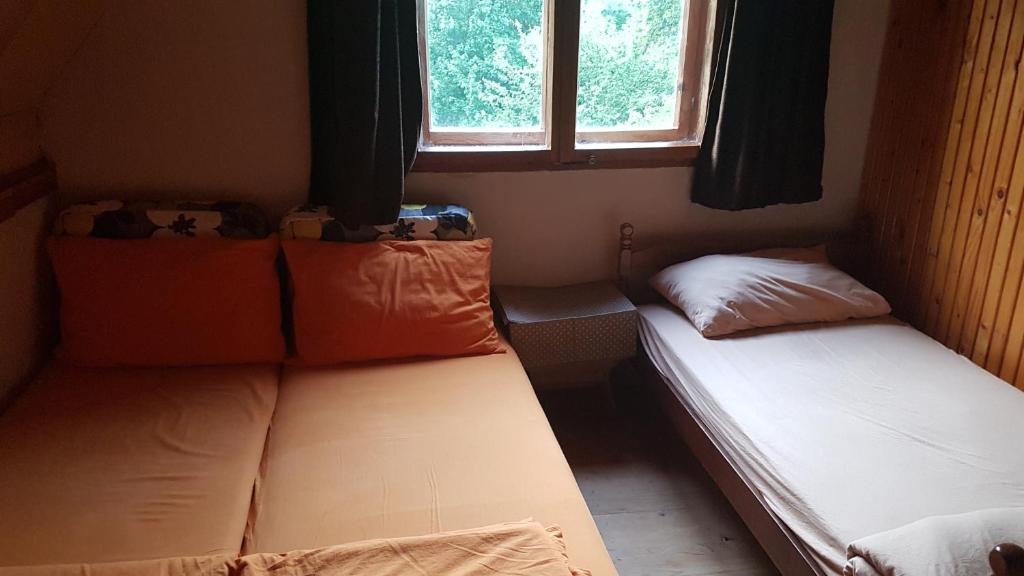 Postel nebo postele na pokoji v ubytování EtnoPetra