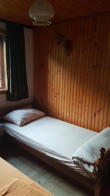 Postel nebo postele na pokoji v ubytování EtnoPetra