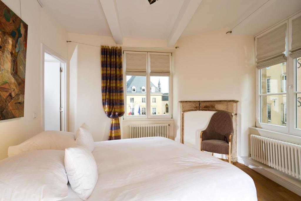 Cama ou camas em um quarto em Hotel Parc Beaux Arts