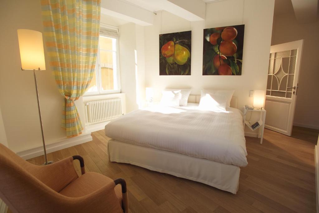 Cama ou camas em um quarto em Hotel Parc Beaux Arts