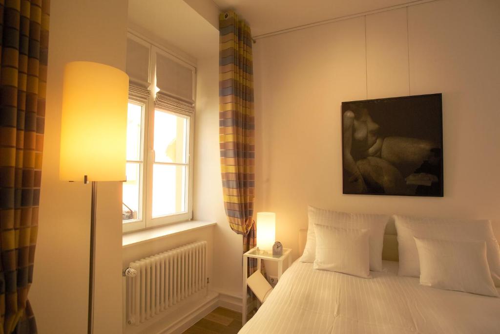 Cama ou camas em um quarto em Hotel Parc Beaux Arts