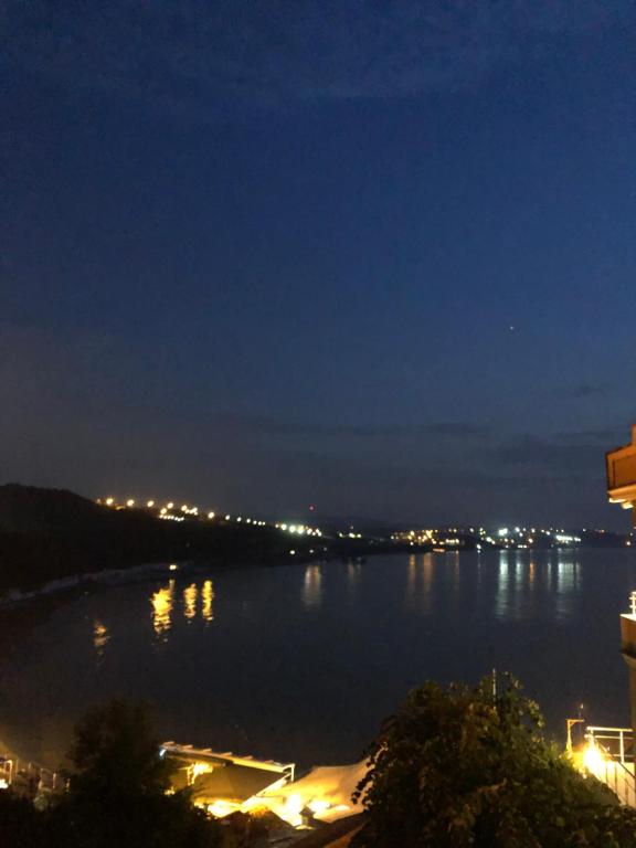 a view of a large body of water at night at Erzurumlu Hotel in Kilyos