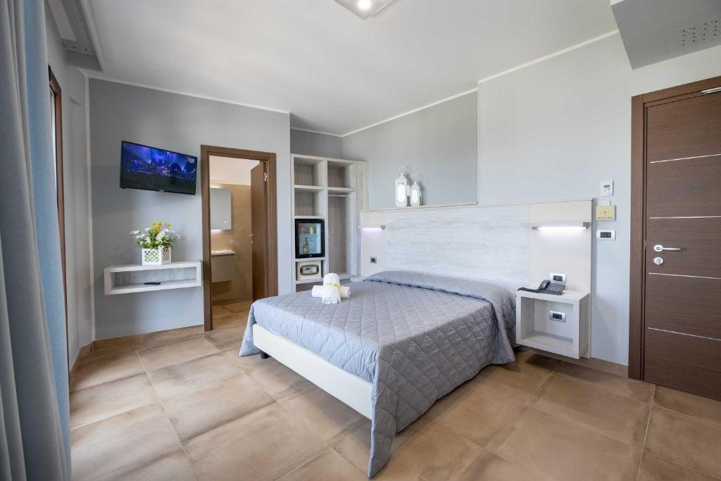 Postel nebo postele na pokoji v ubytování Hotel Salento Mirfran