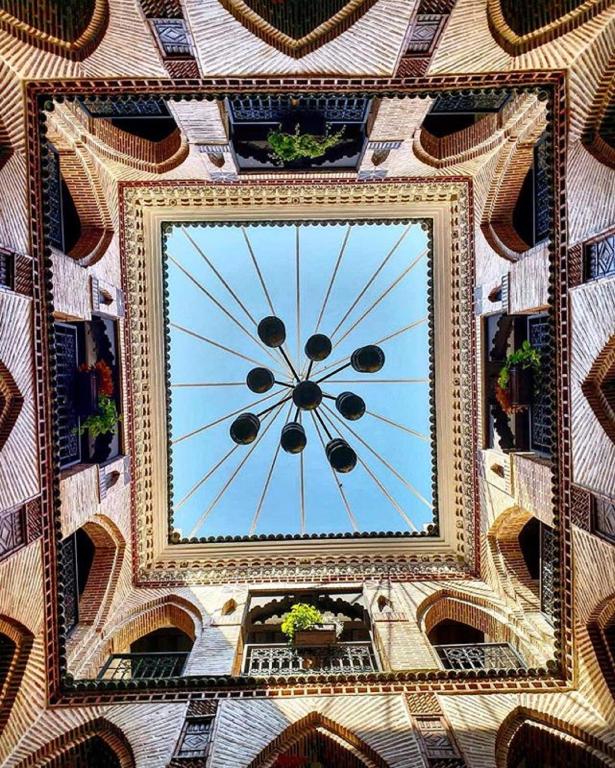 a large clock on the top of a building at Riad Challa Hotel & Spa in Marrakesh