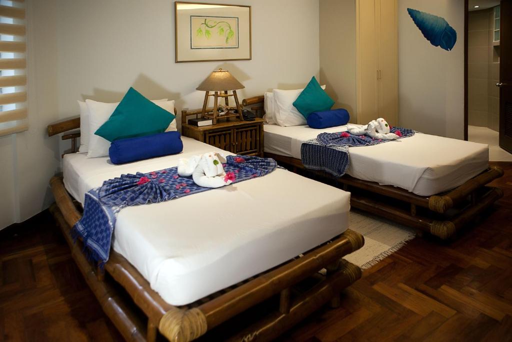 Postel nebo postele na pokoji v ubytování 357 Boracay Resort