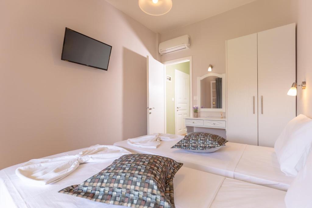 Postel nebo postele na pokoji v ubytování Relax Studios Corfu