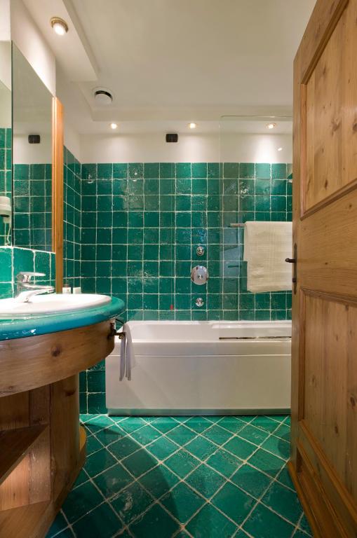 Ванная комната в Hotel Cortina