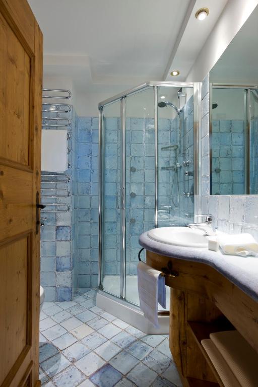 Ванная комната в Hotel Cortina