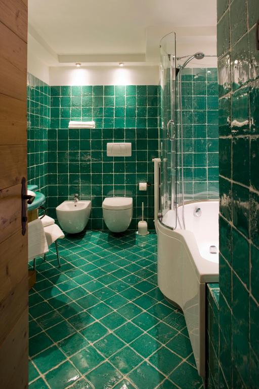 Ванная комната в Hotel Cortina