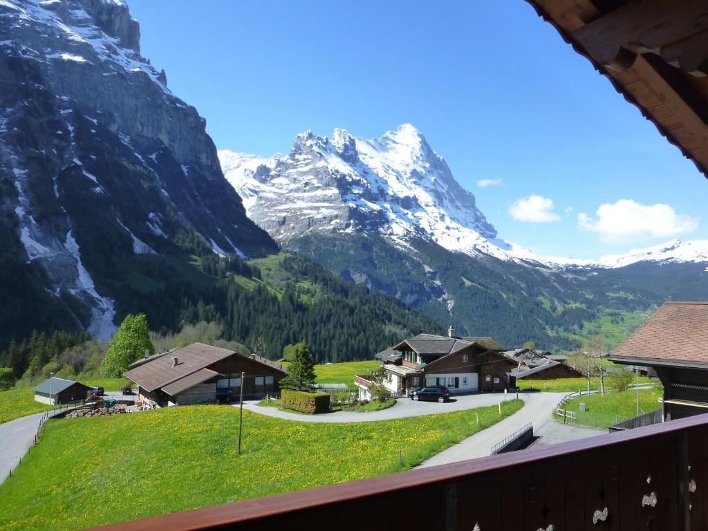 a view of a mountain from the balcony of a house at Chalet Verbrunnenhaus Grindelwald in Grindelwald