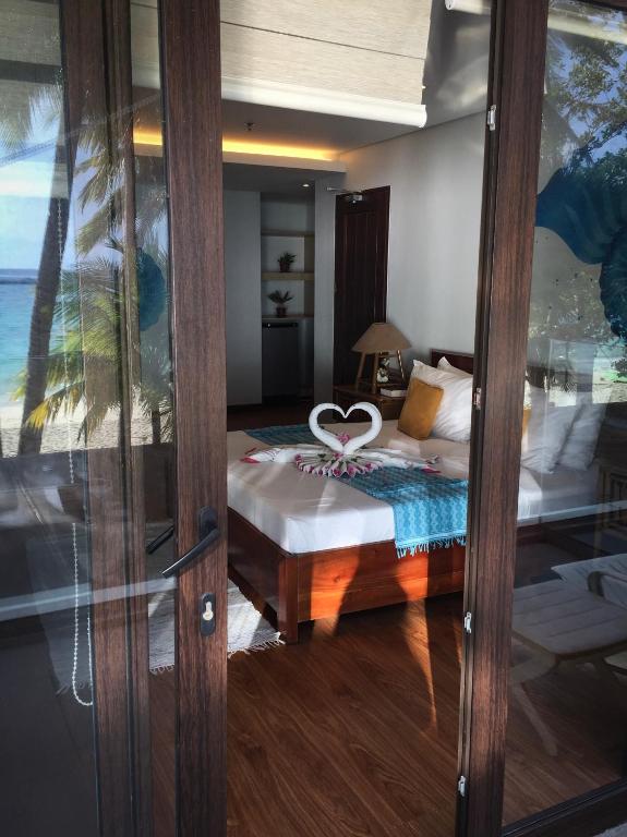 Postel nebo postele na pokoji v ubytování 357 Boracay Resort