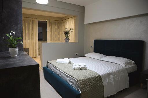 Postel nebo postele na pokoji v ubytování Hotel Miki