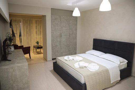 Postel nebo postele na pokoji v ubytování Hotel Miki