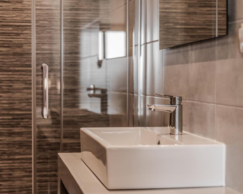 Koupelna v ubytování Poseidonio Hotel