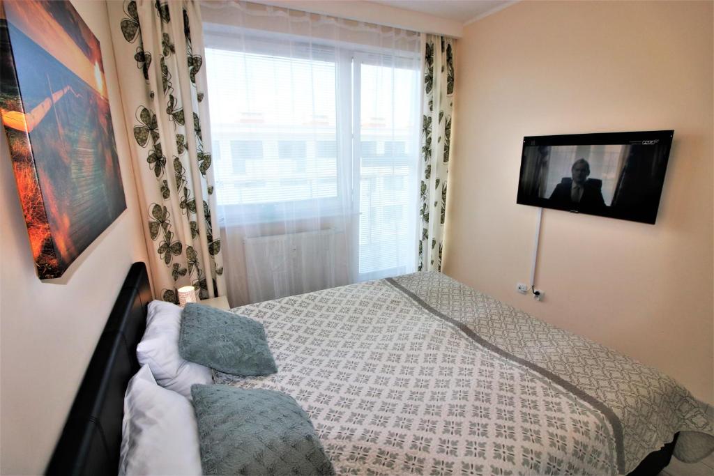 Posteľ alebo postele v izbe v ubytovaní Apartament Superior Pastelowy Przy Plaży