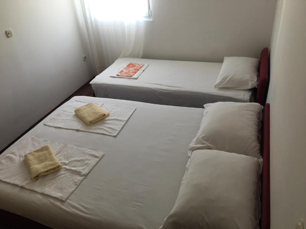 Posteľ alebo postele v izbe v ubytovaní Apartmani Glavina