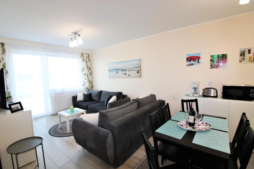 Posedenie v ubytovaní Apartament Superior Pastelowy Przy Plaży