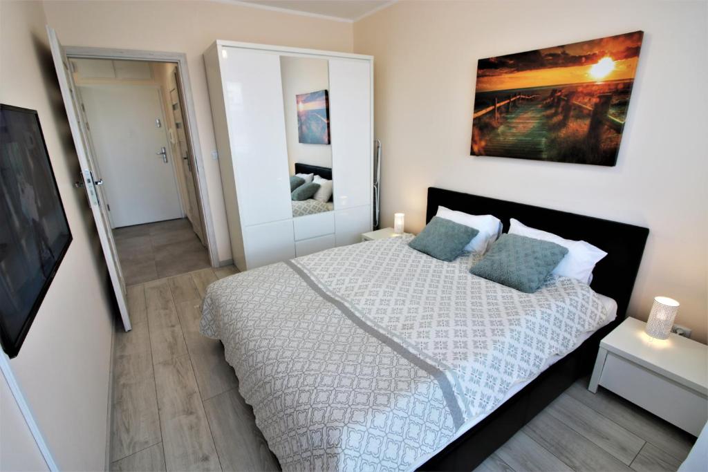 Posteľ alebo postele v izbe v ubytovaní Apartament Superior Pastelowy Przy Plaży