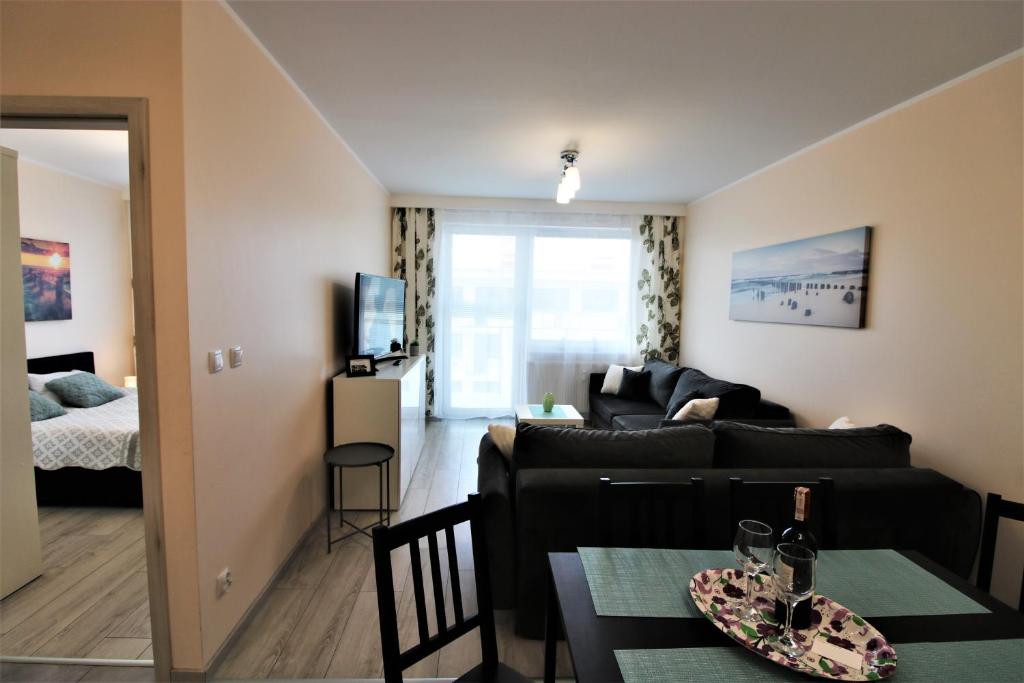 Posteľ alebo postele v izbe v ubytovaní Apartament Superior Pastelowy Przy Plaży