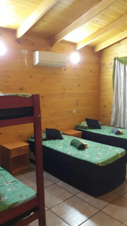 Postel nebo postele na pokoji v ubytování Cabañas La Quinta