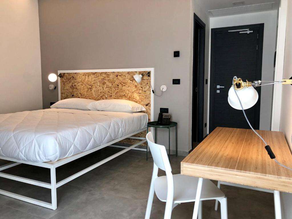 Postel nebo postele na pokoji v ubytování Residence Hotel Moderno