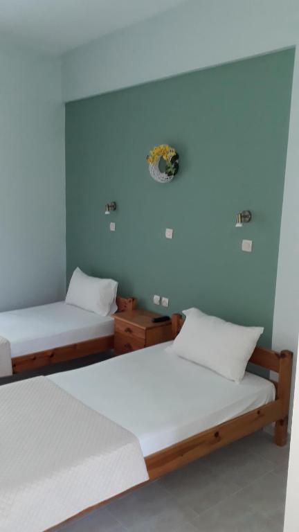 Postel nebo postele na pokoji v ubytování Oasis