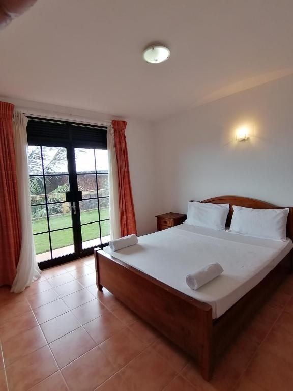Postel nebo postele na pokoji v ubytování Kandy Highland Unique Hotel
