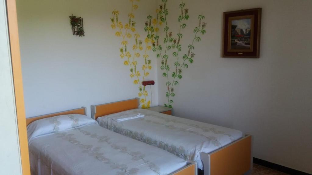 Postel nebo postele na pokoji v ubytování Appartamenti NeMoZo Moretti