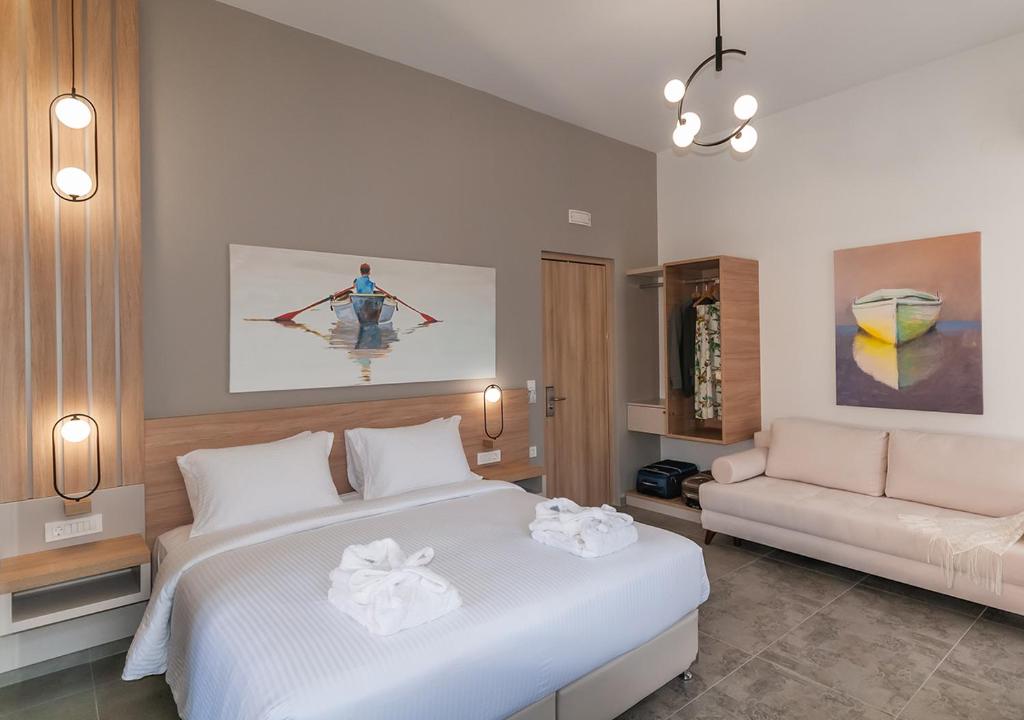 Postel nebo postele na pokoji v ubytování Epavli Boutique Hotel