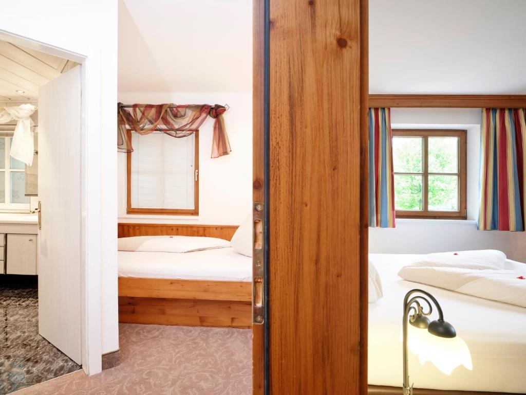 Postel nebo postele na pokoji v ubytování Hotel Hubertus