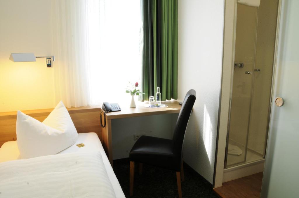 Postel nebo postele na pokoji v ubytování Hotel Zur Traube