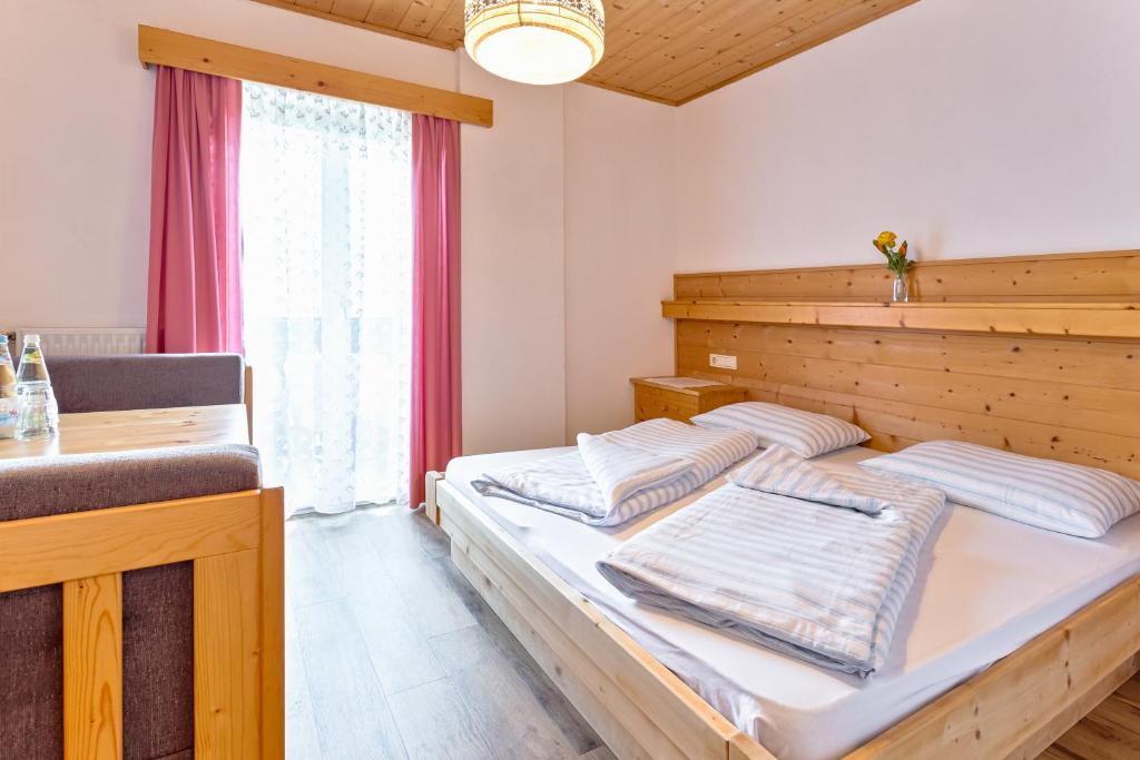 Postel nebo postele na pokoji v ubytování Garni Kircher Sepp