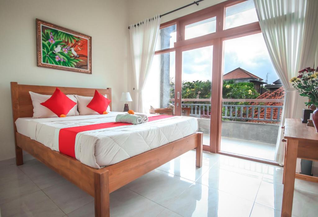 Postel nebo postele na pokoji v ubytování Satya House Ubud