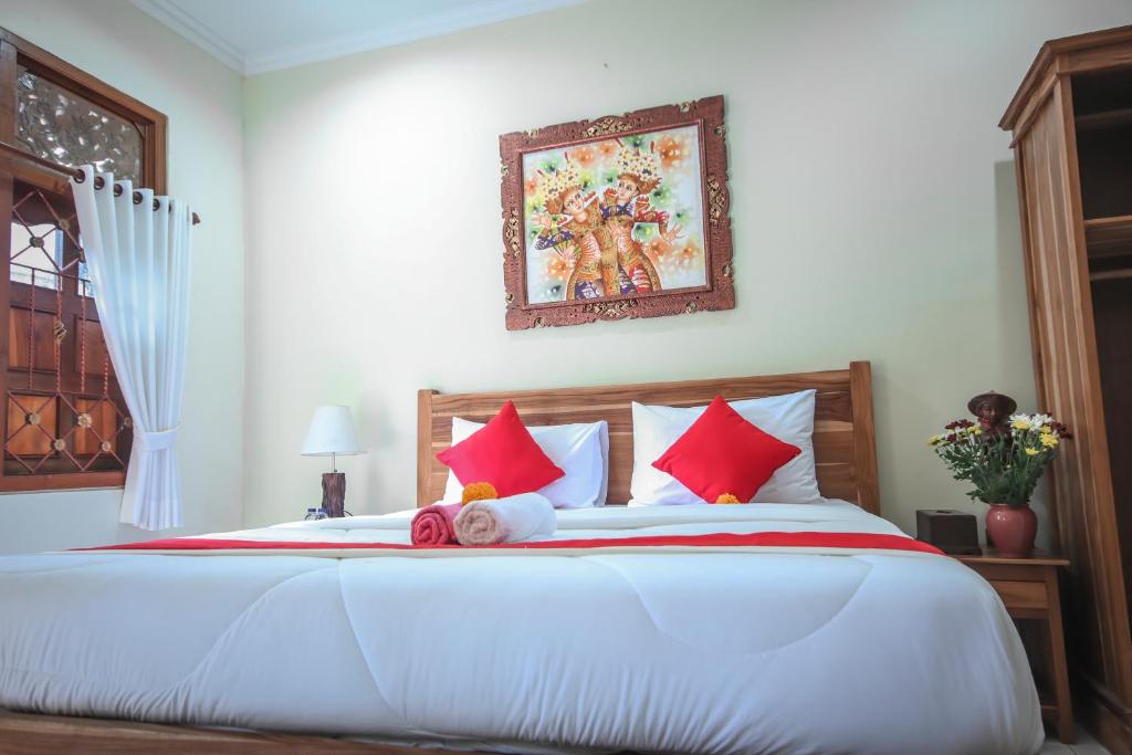 Postel nebo postele na pokoji v ubytování Satya House Ubud