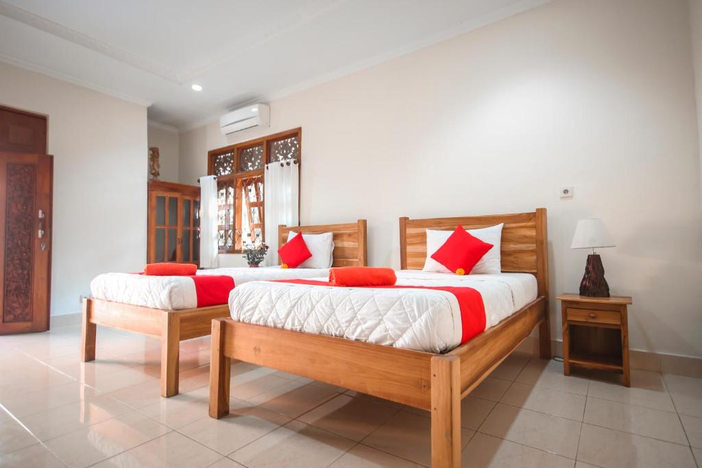 Postel nebo postele na pokoji v ubytování Satya House Ubud