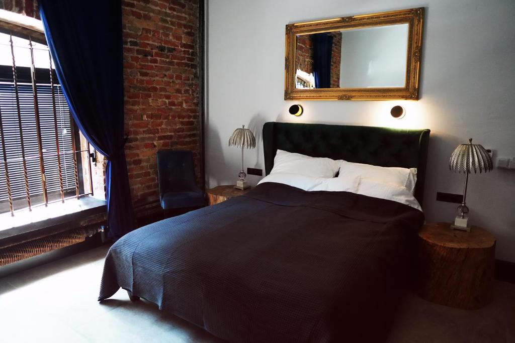 Posteľ alebo postele v izbe v ubytovaní Apartamenty Centrum RS SUITES Kowalska 12