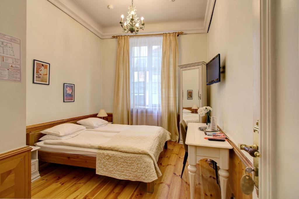 Postel nebo postele na pokoji v ubytování Boutique Hotel KRISTOFS