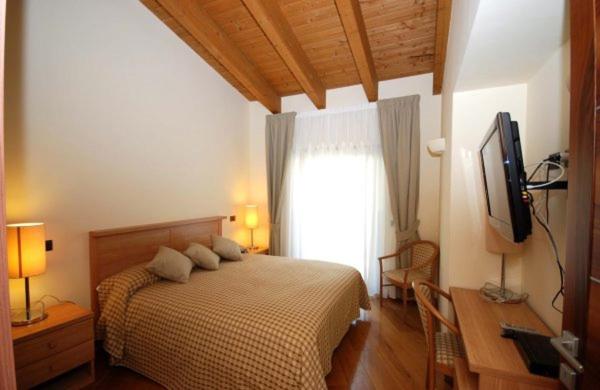Televízia a/alebo spoločenská miestnosť v ubytovaní Tassido Coda Resort