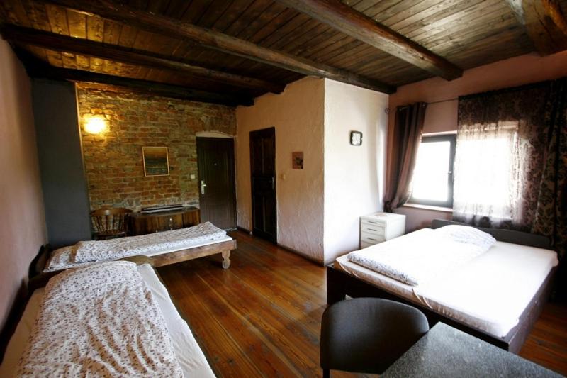 Postel nebo postele na pokoji v ubytování Dom nad Srebrną Rzeką