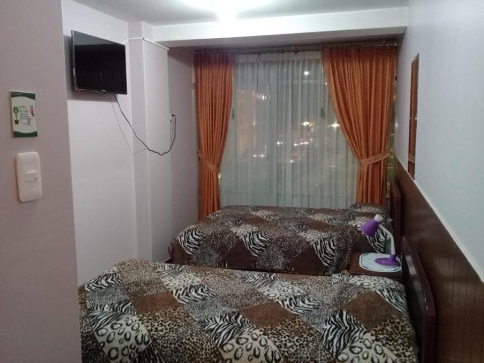 Postel nebo postele na pokoji v ubytování Hotel Cotopaxi