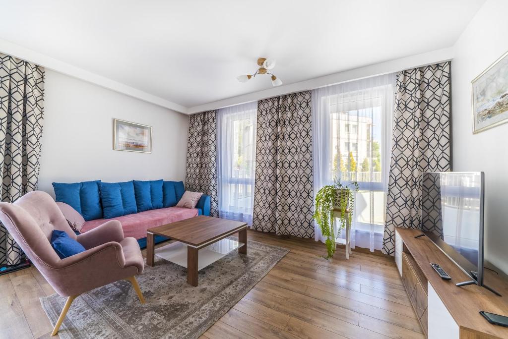 Televízia a/alebo spoločenská miestnosť v ubytovaní Apartament Relax