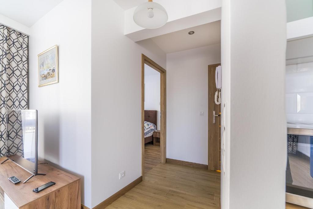 Televízia a/alebo spoločenská miestnosť v ubytovaní Apartament Relax
