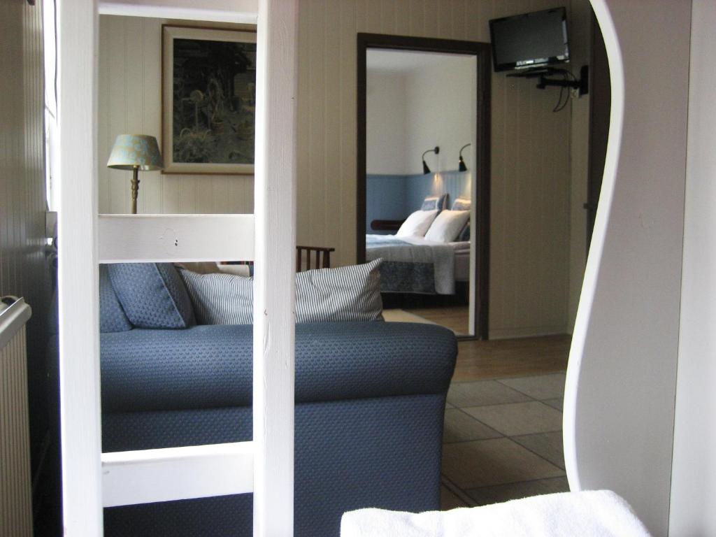 Postel nebo postele na pokoji v ubytování Lugnet Malung Hotell