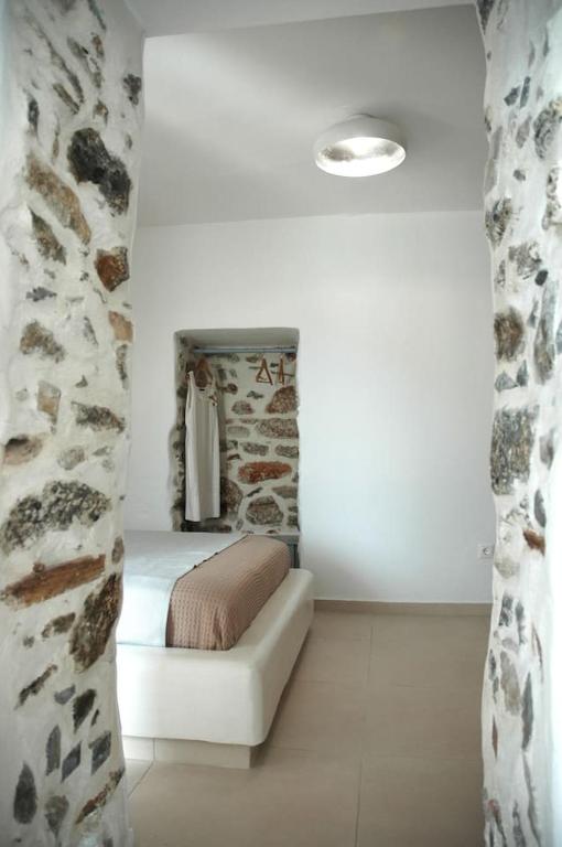 Postel nebo postele na pokoji v ubytování Kalypso House