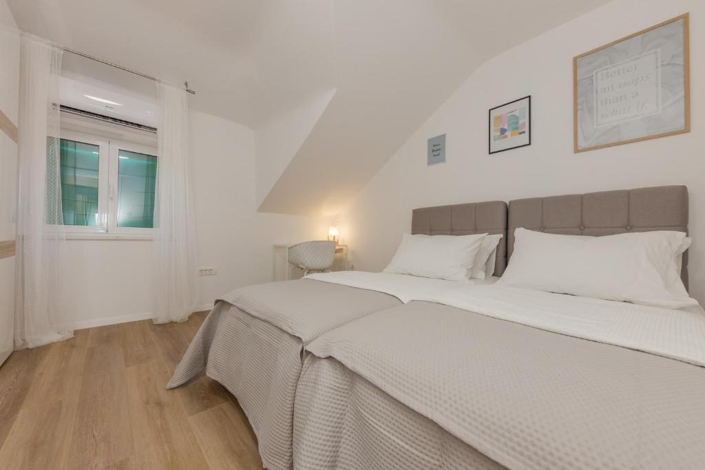 Postel nebo postele na pokoji v ubytování Enjoy Split, new apartment in the center with a private garden