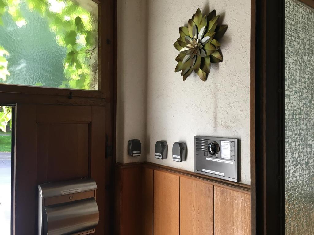 a kitchen with a microwave on the wall next to a window at &quot;An der Lindenberganlage&quot; in Melsungen
