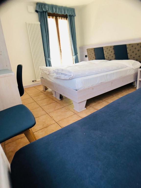 Postel nebo postele na pokoji v ubytování Residence Cima Tosa