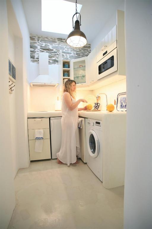 A kitchen or kitchenette at Lasia Boutique Apartment